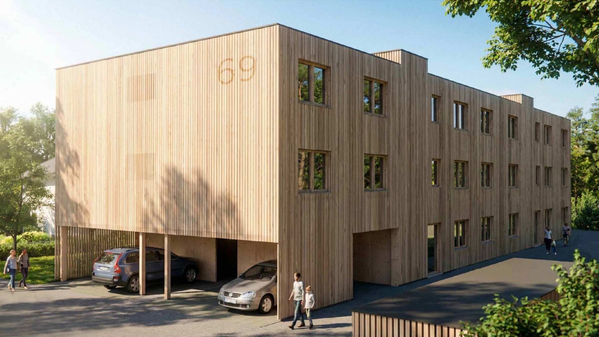 Seitenansicht des modernen Holzhauses mit Zweiraumwohnungen und Holzfassade in Feldkirch-Tosters